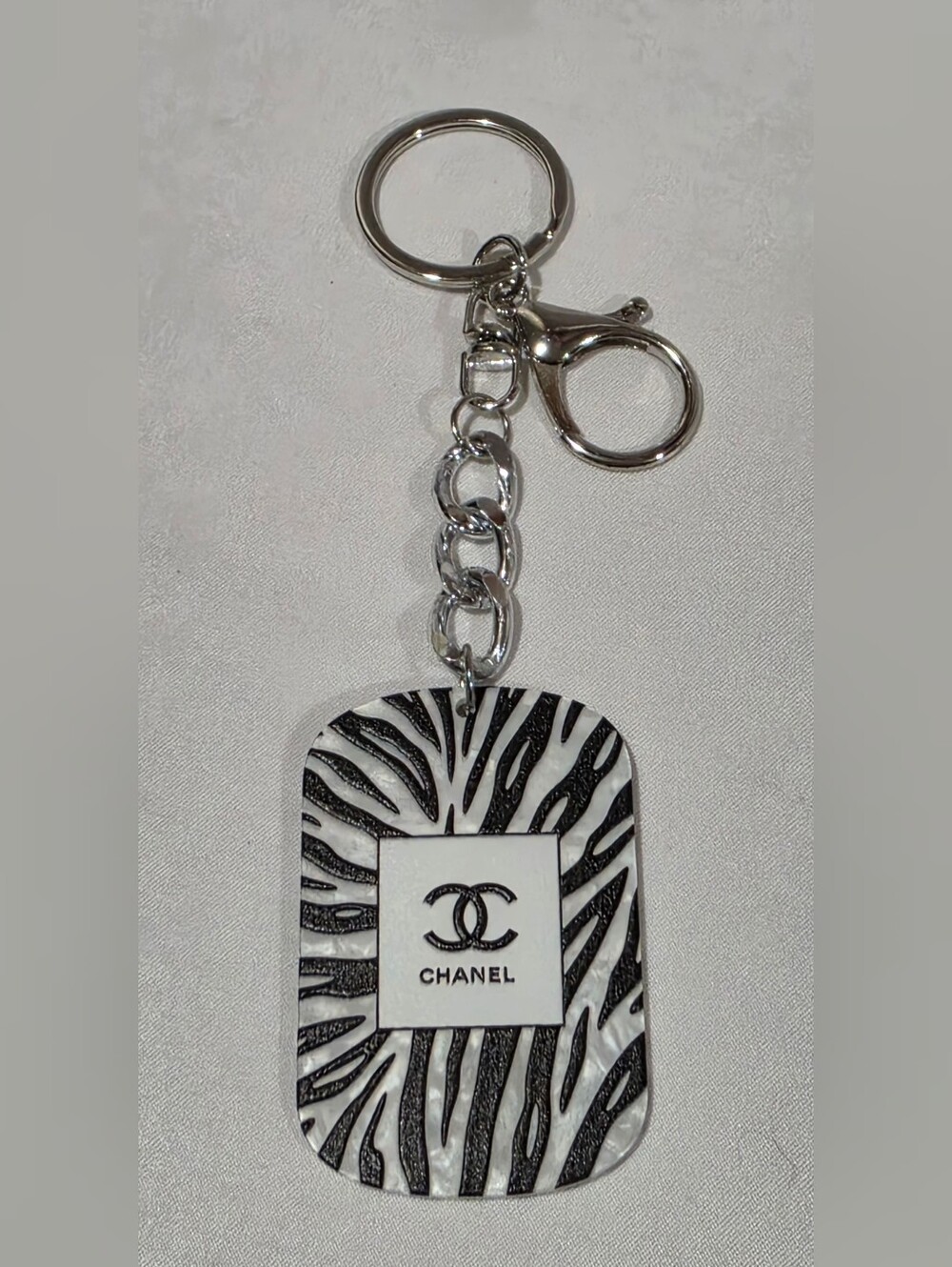 CHANEL Black and White Zebra Logo Keyring with Silver Hardware